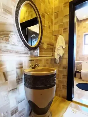 a bathroom with a sink and a mirror at Badr in Amman