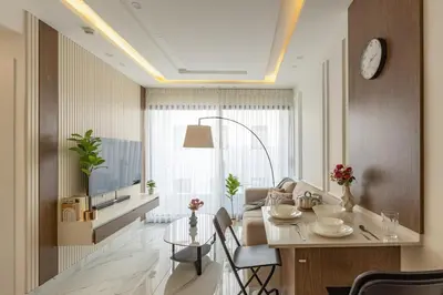 a living room with a table and a couch at Shamsi Apartments 223 in Amman