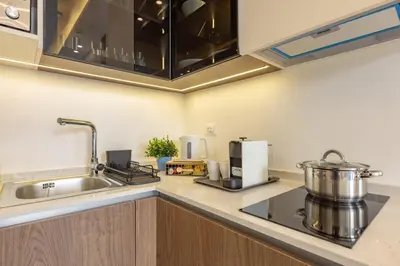 a kitchen with a sink and a counter top at Shamsi Apartments 330 in Amman