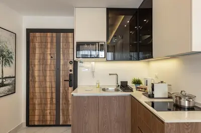 a kitchen with a sink and a counter top at Shamsi Apartments 330 in Amman