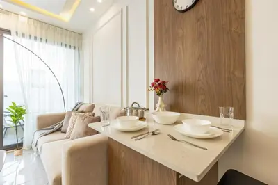 a living room with a table and a couch at Shamsi Apartments 330 in Amman