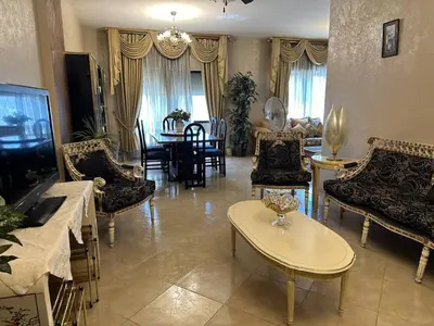 a living room with chairs and a dining room at شقة مفروشة في حي نزال Furnished Apartment Hay Nazzal in Amman