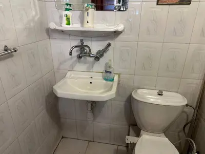 a small bathroom with a toilet and a sink at شقة مفروشة في حي نزال Furnished Apartment Hay Nazzal in Amman