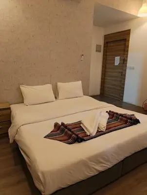 a hotel room with two beds with towels on them at Gate Inn in Amman