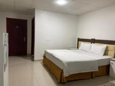 a bedroom with a large bed in a room at asfouer Hostel in Muqbilah