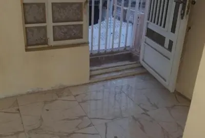an entrance to a room with a gate and a stone floor at asfouer Hostel in Muqbilah