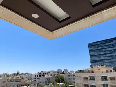 a view of the city from a building at Premium 1BR Furnished Apartment in Amman