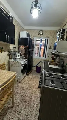 a kitchen with a stove and a stove top oven at VOV House in At-Tafilah