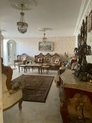 a living room with a couch and a table at zainab house in Amman