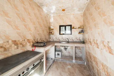 a small bathroom with a sink and a counter at Wadi Rum Sunrise Guesthouse in Wadi Rum