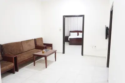 a living room with a couch and a table at النخيل للشقق الفندقية ALnakheel hotel apartment in Aqaba