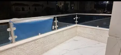 a balcony with a blue and white counter top at Cozy, Newly Furnished & Budget Friendly Apartment in Amman
