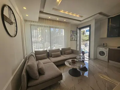 a living room with a couch and a table at Shamsi Apartments 008 in Amman