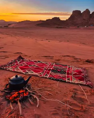 a pot sitting on top of a net on the desert at Wadi rum Mahmoud tours in Wadi Rum