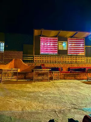 a building with two benches in front of it at Faraj wadi rum in Disah