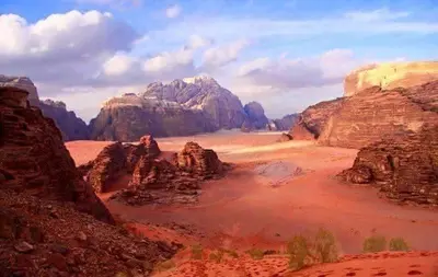 a view of a desert with rocks and mountains at Faraj wadi rum in Disah