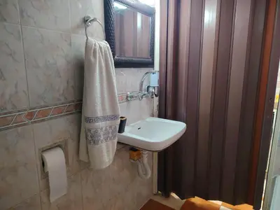 a bathroom with a sink and a towel at بيت الحجر in Amman