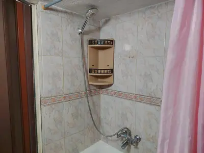 a shower with a soap dispenser in a bathroom at بيت الحجر in Amman