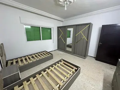 a room with two bunk beds and a door at Beautiful apartment in Irbid