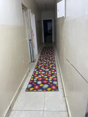 a hallway with a colorful rug on the floor at جبال الاردن in Amman
