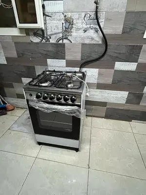 a stove sitting on the floor in a kitchen at جبال الاردن in Amman