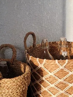 two wicker baskets with two bottles in them at Petra Masterpiece in Wadi Musa