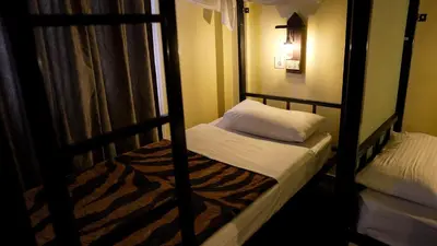 a couple of bunk beds in a room at Rafiki Hostel in Wadi Musa