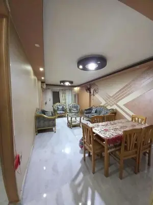 a dining room with a table and chairs in a room at رزق هاوس in Ash Shūnah ash Shamālīyah