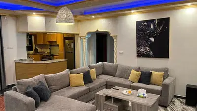 a living room with a couch and a table at Royal in Aqaba
