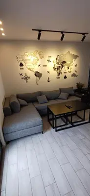 a living room with a couch and a table at LAVA Resort Hot spring water in Mukāwir