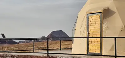a small building with a door in the desert at Eram camp in Jurf ad Darāwīsh