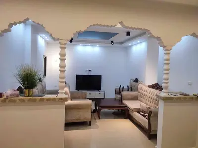 a living room with a couch and a tv at bong chalet in Amman