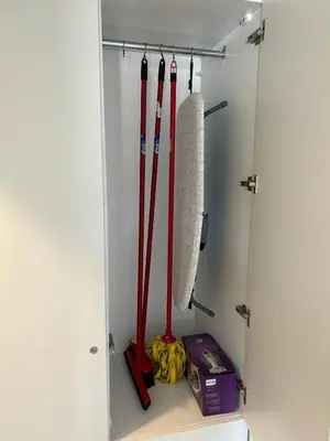 a closet with some baseball bats andanas in it at Ayla Beach Apartment Azure 1522 Families only in Aqaba