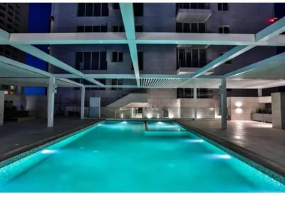 a swimming pool in the middle of a building at Boulevard luxury Studio in Amman