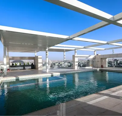 a swimming pool on the roof of a building at Boulevard luxury Studio in Amman