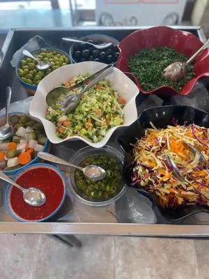 a tray of different types of food on a table at Bedouin Luxury Camp in Wadi Rum