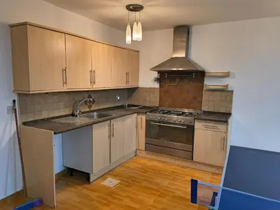a kitchen with a sink and a stove top oven at Shafa Badran Studio in Jurf ad Darāwīsh