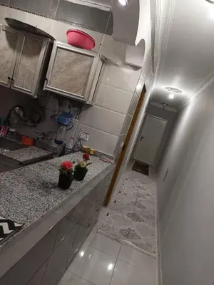 an overhead view of a kitchen with a counter at مخيم الخال in Yarqā