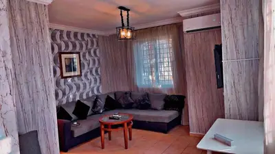 a living room with a couch and a table at شقق ڤيڤا - viva Apartments in Amman