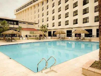 a large swimming pool in front of a hotel at Aqaba Gulf Hotel By FHM in Aqaba