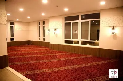 a large room with a red carpet on the floor at Der Ghbar Luxe in Amman
