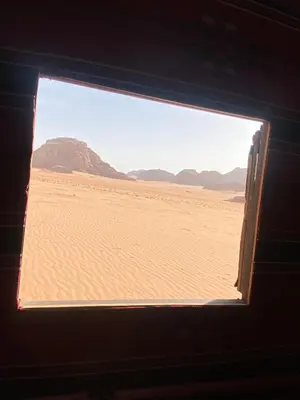 a window in a room with a view of the desert at Wadi Rum Desert Experience in Wadi Rum