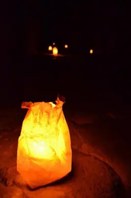a glowing object is sitting on the ground at night at man -soor in Amman