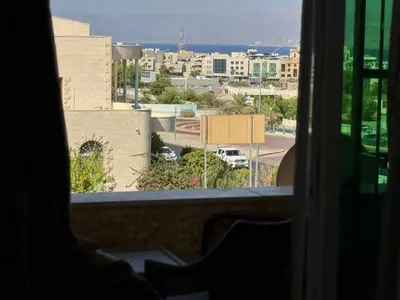 a view of a city from a window at Al-Amer شقق الخامسه الراقيه in Aqaba