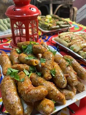 a plate of food on a table with food at شقه الحنان in Dayr as Si‘nah