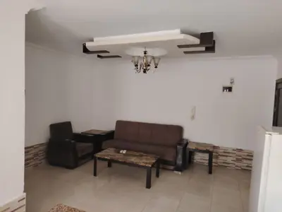 a living room with a couch and a table at Apartments for Rent in Irbid