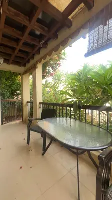 a patio with a table and chairs on a porch at arabian gulf in Al Burj