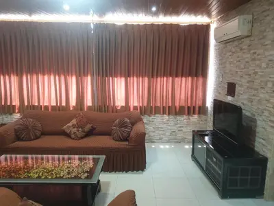 a living room with a couch and a fireplace at الاردن عمان تلاع العلي شارع ابو يوسف الأنصاري اسكان طارق الشيخ in Amman