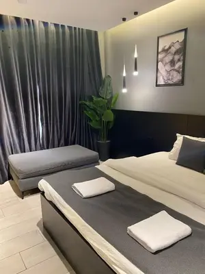 a bedroom with two beds with towels on them at beautiful apartment in the DeadSea in Sowayma