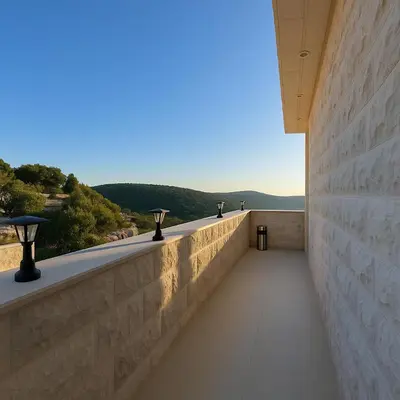 a walkway in a building with mountains in the background at Jordan Castle Resort in Irbid